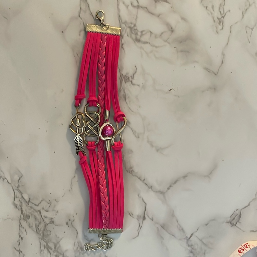 A Hot Pink bracelet with 4 charms